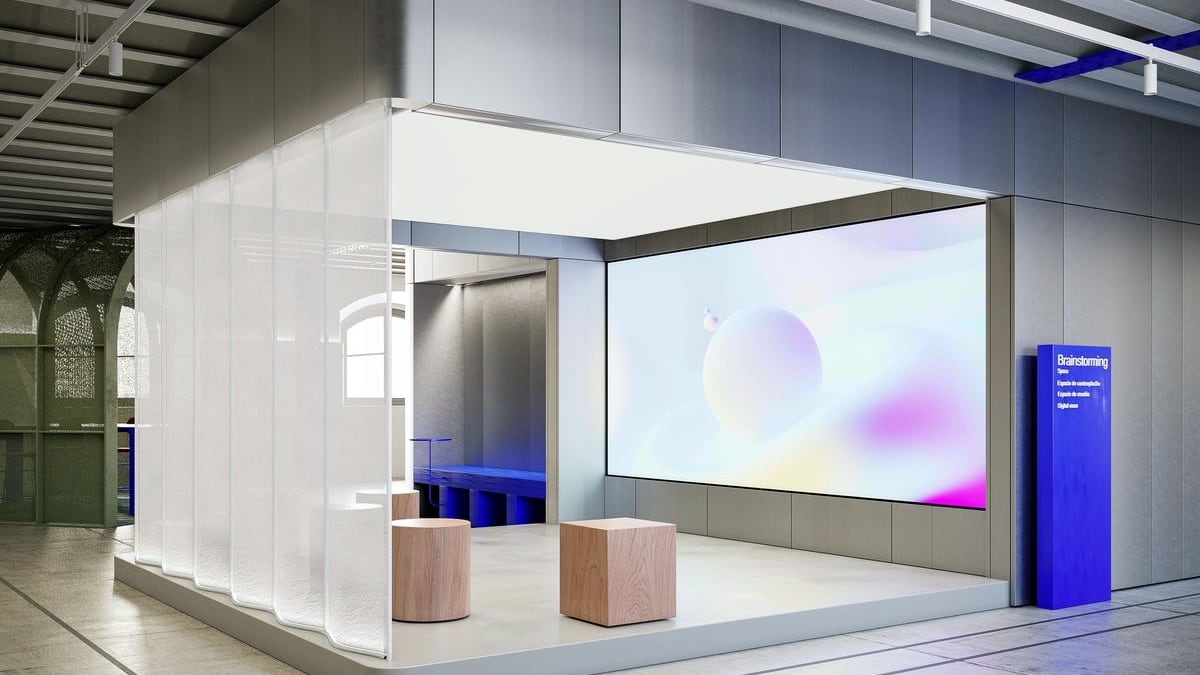 Stand with translucent partitions, a display screen and low seating.